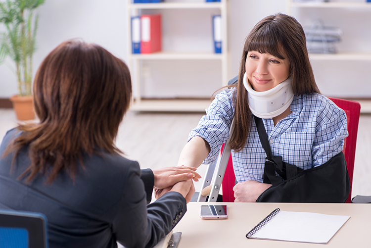 Injured employee visiting lawyer for advice on insurance - Decatur, IL
